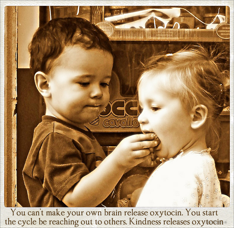 cute boy feeding sweet girl highlighting the release of oxytocin with acts of kindness